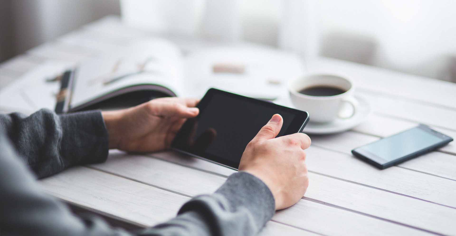 man holding a tablet